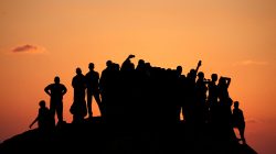 Palestinian demonstrators gather atop a hill during a protest calling for lifting the Israeli blockade on Gaza, near the maritime border with Israel, in the northern Gaza Strip September 17, 2018. REUTERS/Mohammed Salem
