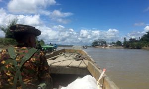 FILE PHOTO: A Myanmar soldier patrols in a boat at the Mayu river near Buthidaung in the north of Rakhine state, Myanmar September 13, 2017. REUTERS/Stringer