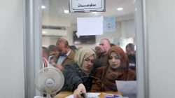 Palestinian Hamas-hired employees receive full salaries for the first time in years, in the southern Gaza Strip November 9, 2018. REUTERS/Ibraheem Abu Mustafa