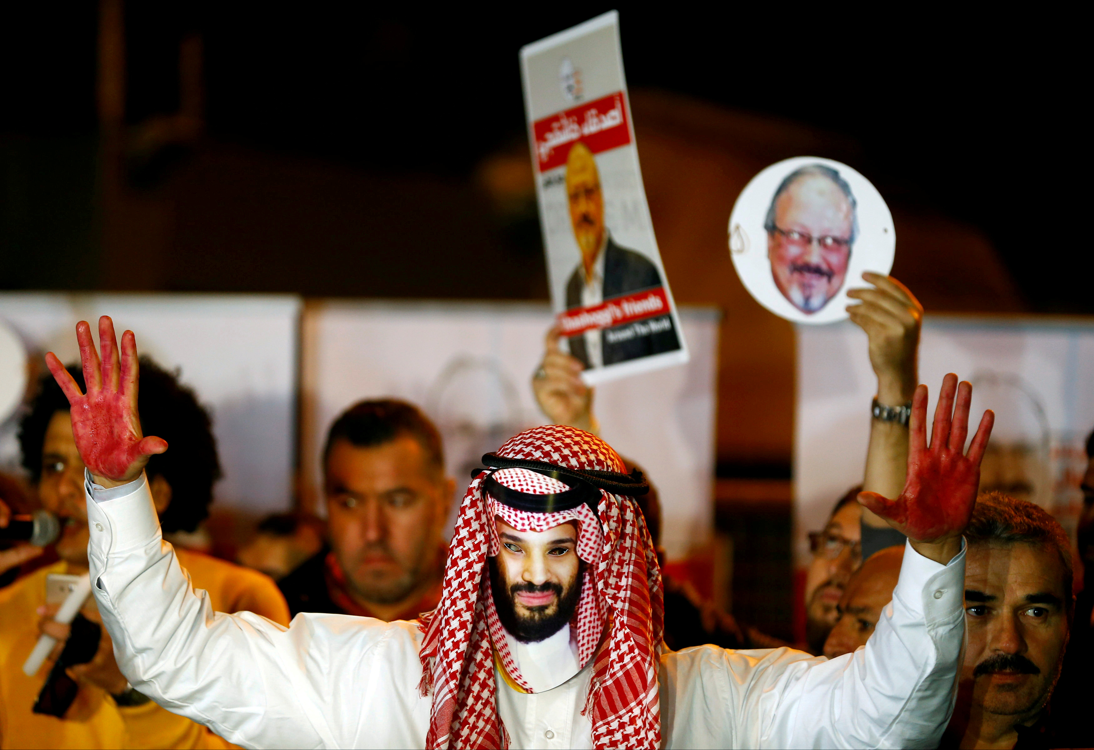 FILE PHOTO: A demonstrator wearing a mask of Saudi Crown Prince Mohammed bin Salman attends a protest outside the Saudi Arabia consulate in Istanbul, Turkey October 25, 2018. REUTERS/Osman Orsal//File Photo