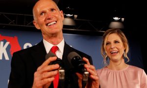 FILE PHOTO: Republican U.S. Senate candidate Rick Scott is accompanied by his daughter Allison Guimard as he addresses supporters at his midterm election night party in Naples, Florida, U.S. November 6, 2018. REUTERS/Joe Skipper/File Photo