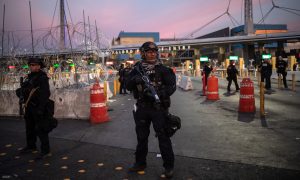 U.S. Customs and Border Protection (CBP) Special Response Team (SRT) officers stand guard at the San Ysidro Port of Entry after the land border crossing was temporarily closed to traffic from Tijuana, Mexico November 19, 2018. REUTERS/Adrees Latif