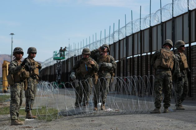 FILE PHOTO: U.S. Marines deploy concertina wire at the U.S. Mexico border in preparation for the arrival of a caravan of migrants at the San Ysidro border crossing in San Diego, California, U.S. November 15, 2018. REUTERS/Mike Blake