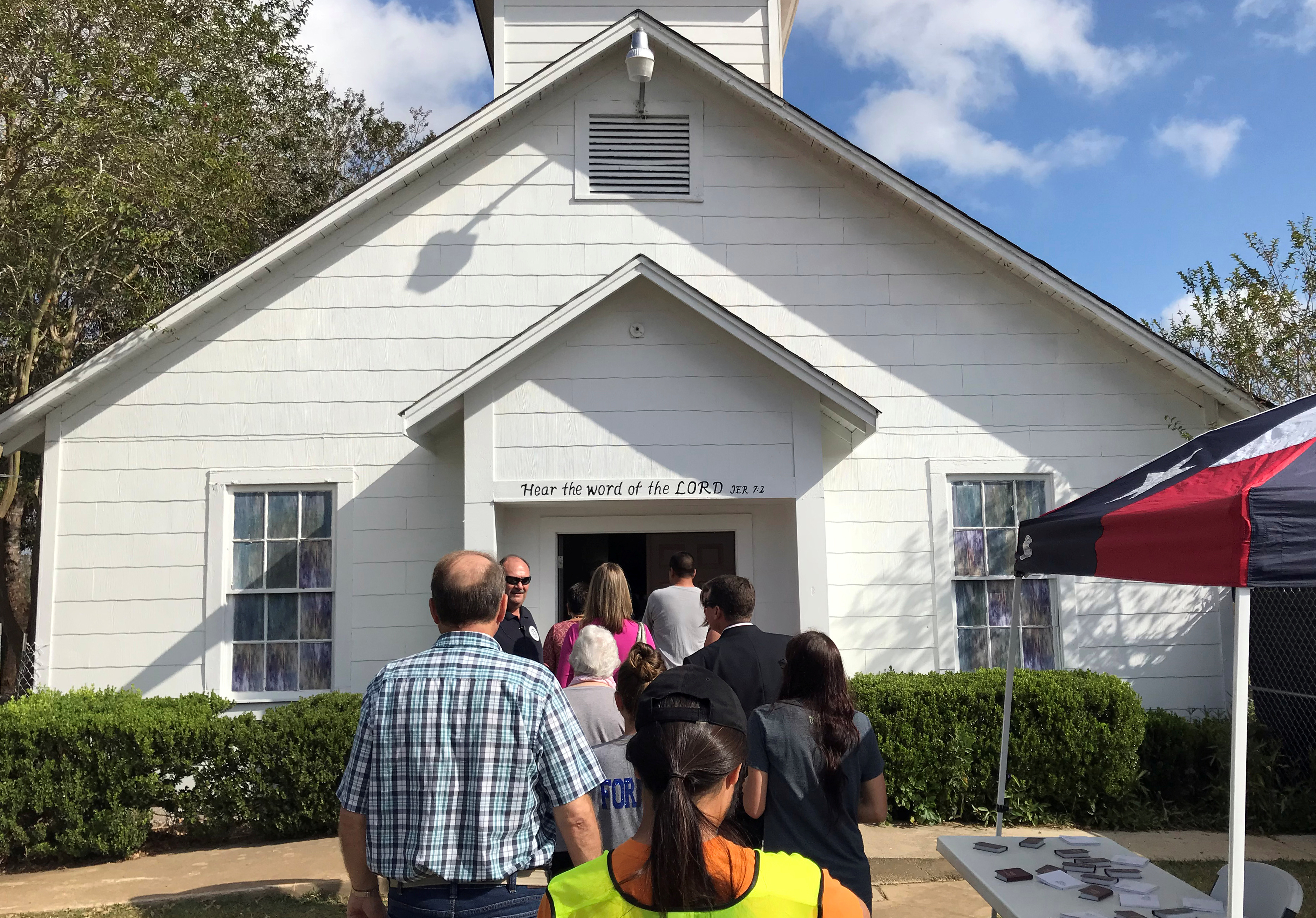 People gather to enter a memorial in the Sutherland Springs First Baptist Church where a memorial has been set up to remember those killed there, in a mass shooting in Sutherland Springs, Texas, U.S. November 15, 2017. REUTERS/Jon Herskovitz