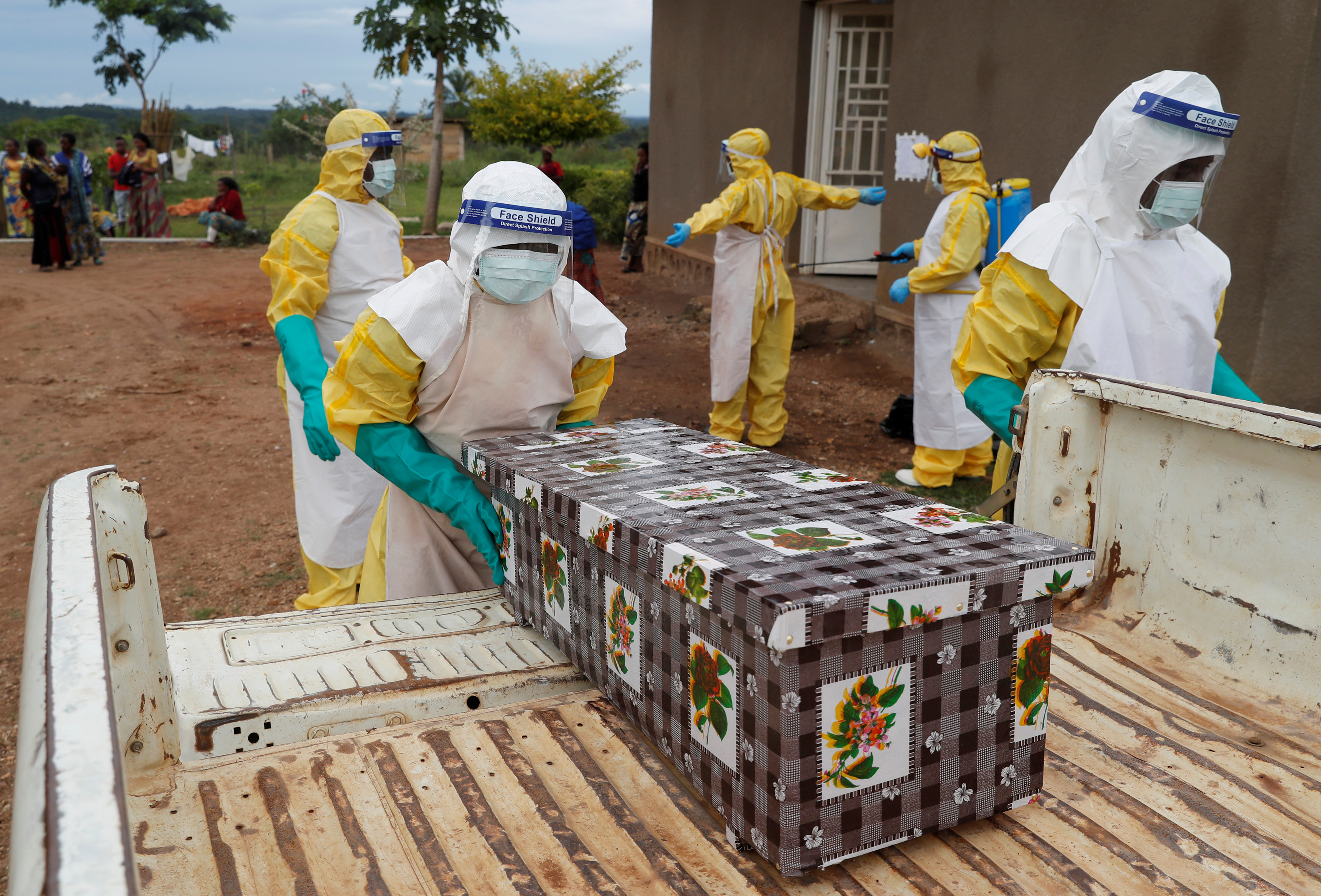 FILE PHOTO: Healthcare workers carry the coffin of a baby believed to have died of Ebola, in Beni, North Kivu Province of Democratic Republic of Congo, December 15, 2018. REUTERS/Goran Tomasevic/File Photo