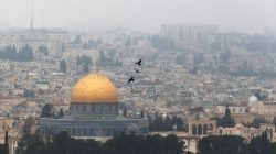 Birds fly on a foggy day near the Dome of the Rock, located in Jerusalem's Old City on the compound known to Muslims as Noble Sanctuary and to Jews as Temple Mount, Jerusalem, January 2, 2018. REUTERS/Ammar Awad