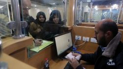 A Palestinian Hamas-hired police officer checks the documents of people upon their return from Egypt, at Rafah border crossing in the southern Gaza Strip January 8, 2019. REUTERS/Ibraheem Abu Mustafa