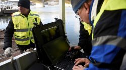Volunteers of Israeli rescue and recovery organisation ZAKA survey images transmitted by an underwater sonar during a search for the remains of Holocaust victims murdered on the banks of the Danube river in 1944 in Budapest, Hungary January 15, 2019. REUTERS/Tamas Kaszas
