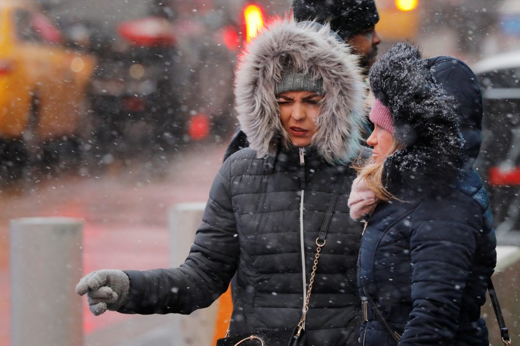 Widening snowstorm, freezing rain to snarl travel in eastern U.S.