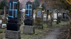 Graves desecrated with swastikas are seen in the Jewish cemetery in Quatzenheim, near Strasbourg, France, February 19, 2019. REUTERS/Vincent Kessler