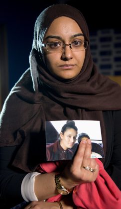 FILE PHOTO: Renu Begum, sister of teenage British girl Shamima Begum, holds a photo of her sister as she makes an appeal for her to return home at Scotland Yard, in London, Britain February 22, 2015. REUTERS/Laura Lean/Pool/File Photo