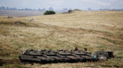 FILE PHOTO: Israeli soldiers stand on tanks near the Israeli side of the border with Syria in the Israeli-occupied Golan Heights, Israel May 9, 2018. REUTERS/Amir Cohen/File Photo