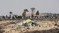 FILE PHOTO: Ethiopians search for remains at the Ethiopian Airlines Flight ET 302 plane crash before a commemoration ceremony at the scene of the crash, near the town of Bishoftu, southeast of Addis Ababa, Ethiopia March 13, 2019. REUTERS/Baz Ratner
