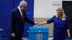 Israel’s Prime Minister Benjamin Netanyahu casts his vote with his wife Sara during Israel's parliamentary election in Jerusalem April 9, 2019. Ariel Schalit/Pool via REUTERS