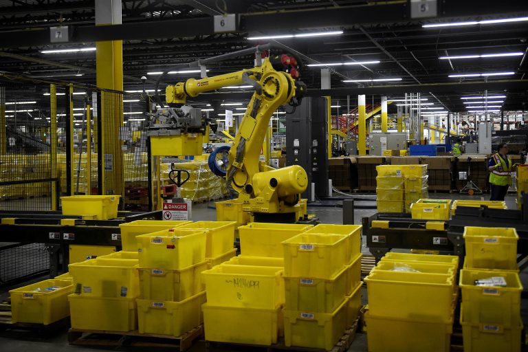Exclusive Amazon rolls out machines that pack orders and