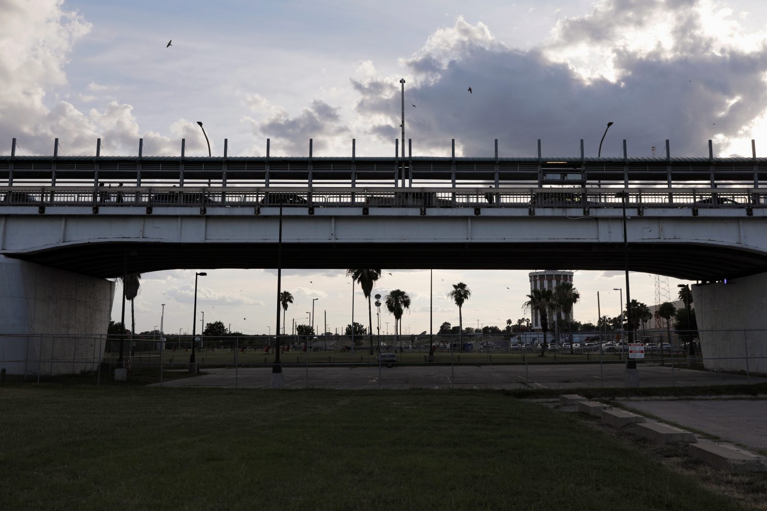 Vehicles and people cross the border bridge into the U.S., as seen from Laredo, Texas June 2, 2019. REUTERS/Carlos Jasso