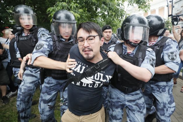 Law enforcement officers detain a participant of a rally in support of Russian investigative journalist Ivan Golunov, who was detained by police, accused of drug offences and later freed from house arrest, in Moscow, Russia June 12, 2019. REUTERS/Shamil Zhumatov