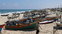 A Palestinian fisherman walks on a beach in the southern Gaza Strip June 13, 2019. REUTERS/Ibraheem Abu Mustafa