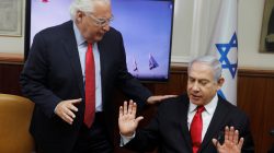 Israeli Prime Minister Benjamin Netanyahu and U.S. Ambassador to Israel David Friedman talk after watching a video of Israel's U.S.-backed Arrow-3 ballistic missile shield performing a series of live interception tests over Alaska, U.S., during a cabinet meeting in Jerusalem July 28 2019. Menahem Kahana/Pool via REUTERS